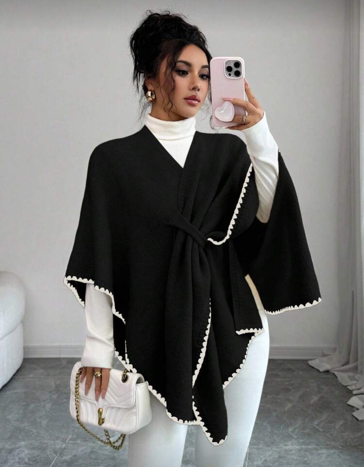 Poncho élégant à coupe fluide avec finitions raffinées